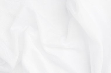 Beyaz kumaş dokusu lüksü. Dalgalanan ipek kumaşın yakın çekimi. Soyut kumaş veya sıvı dalga arkaplanı..