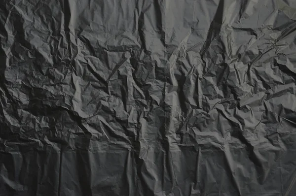 Мусорный Мешок Текстура Фона Черная Скомканная Пластиковая Стена Обои Вид — стоковое фото