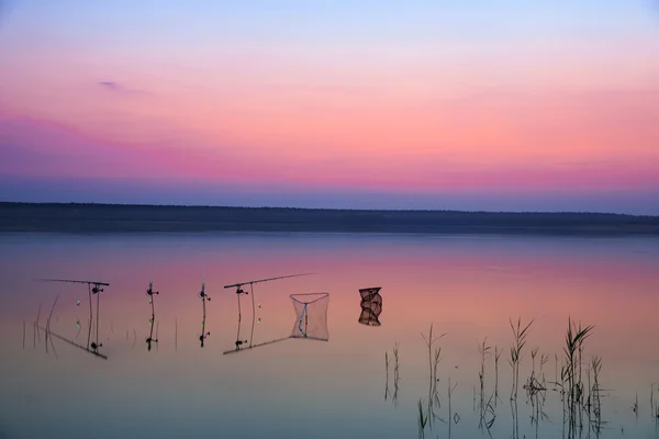 Fishing on the lake at sunset