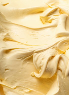 Vanilya aromalı dondurma - tüm çerçeve ayrıntıları. Vanilyalı dondurmanın bej rengi yüzey dokusunu kapat.