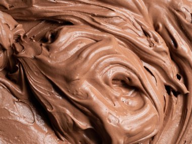 Çikolata aromalı gelato - tüm çerçeve detay. Çikolatalı dondurmanın kahverengi yüzey dokusunu kapat..