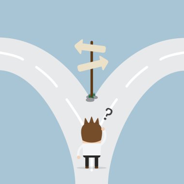 Kavşak noktasında duran iş adamı