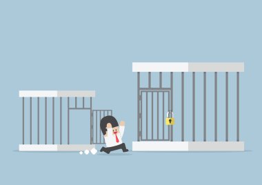 Businessman runing out from small cage to the bigger cage clipart