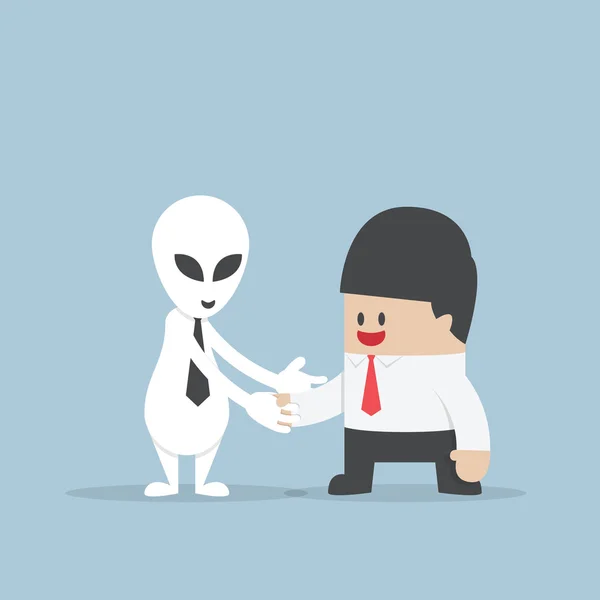 Empresário apertando as mãos com Alien — Vetor de Stock