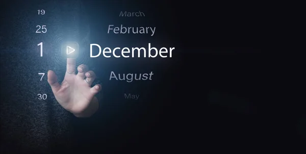 12月1日 月の1日 カレンダーの日付 濃い青の背景にある明るいアイコンの再生と日付を手でクリックします 冬の月 その年のコンセプトの日 — ストック写真
