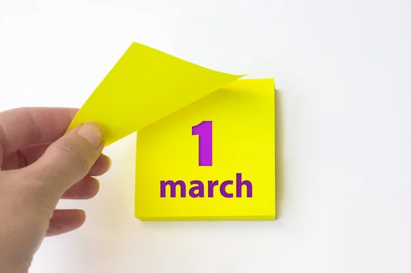 March 1St Day Month Calendar Date Hand Rips Yellow Sheet — Stok fotoğraf