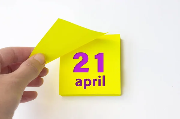 April 21St Day Month Calendar Date Hand Rips Yellow Sheet — Stockfoto