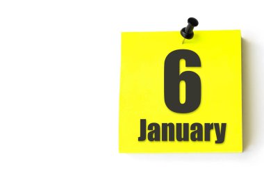 6 Ocak. Ayın 6 'sı, takvim tarihi. Takvimin sarı sayfası. Kış ayı, yılın günü konsepti.