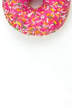 Creamy delicious donut doughnut . Donut in pink glaze with colored sprinkles
