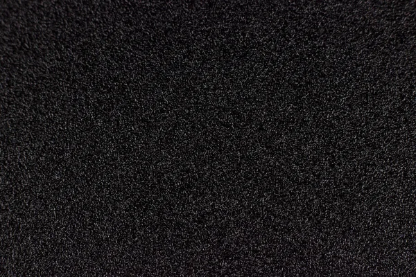 Black Abstract Background Or Texture, black rough background. Waterproof abrasive paper texture. Black sandpaper texture