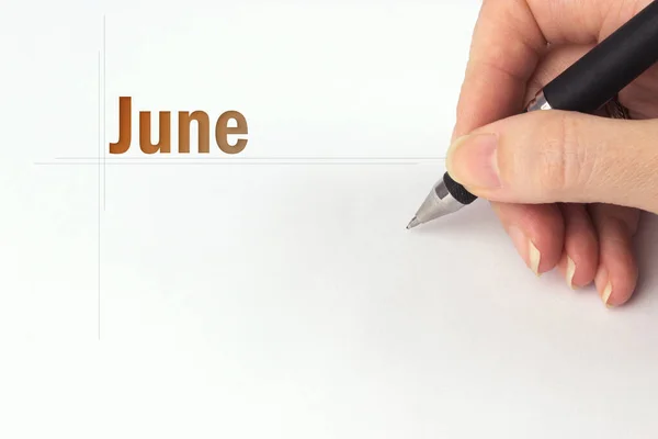 Czerwiec Miesiąc Miesiąc Kalendarzowy Ręka Trzyma Czarny Długopis Zapisuje Datę — Zdjęcie stockowe