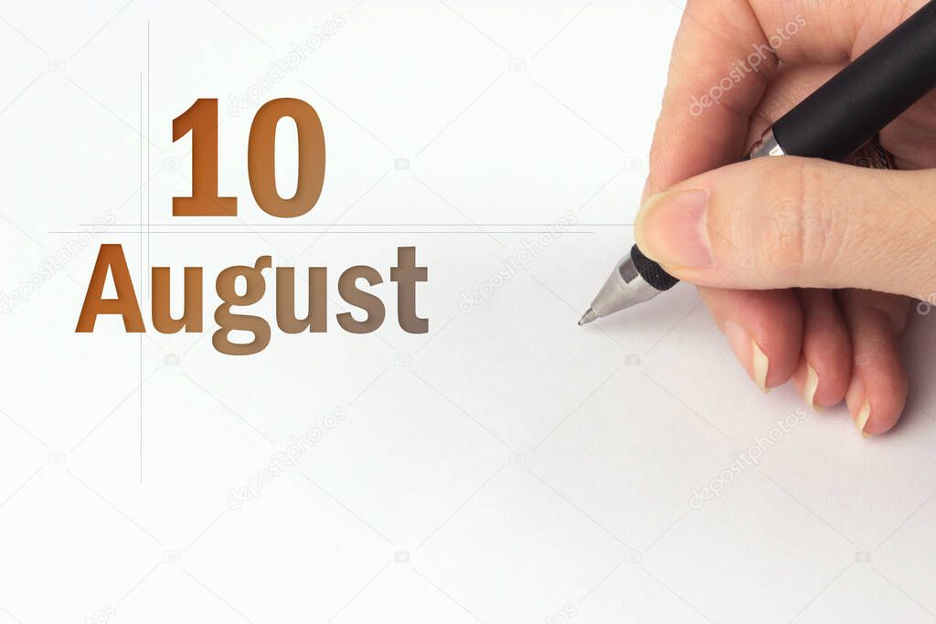 August 10th. Day 10 of month, Calendar date. The hand holds a black pen and writes the calendar date. Summer month, day of the year concept