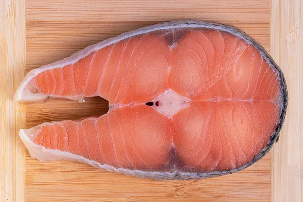 Fresh trout steak on wooden surface — Stock Image Fresh Trout Steak Wooden Surface Royalty Free Stock Images