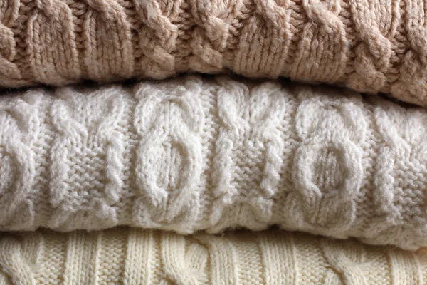 Háttérben a meleg pulóverek — Stock Fotó