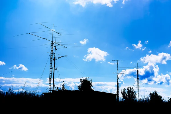 Antennas and transmitters on poles — Stock Photo, Image