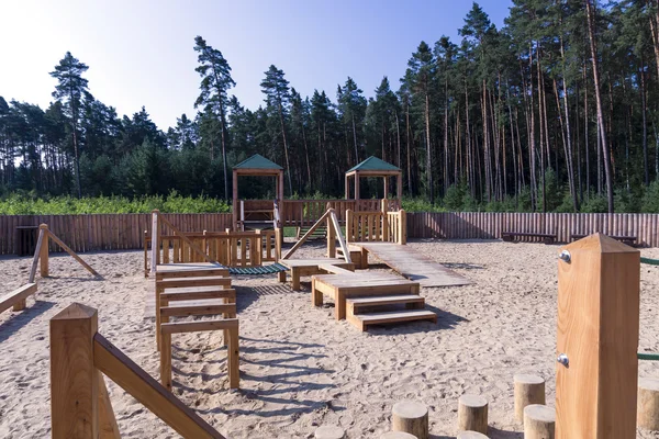 Children's wooden playground in the woods — Stock Photo, Image