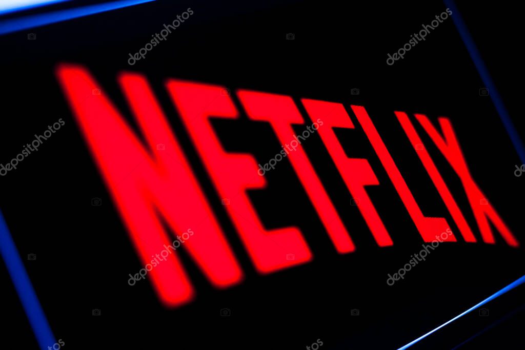 Kyiv, Ukraine -  March 9, 2021: Netflix logo on the screen. Netflix is an American content platform and production company offering online streaming service from a library of films and TV series.