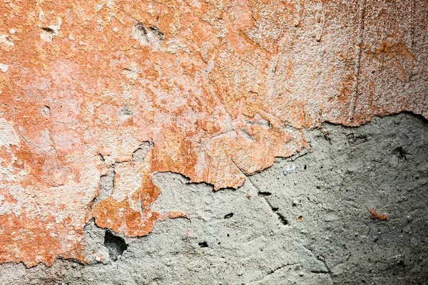 Superfície de concreto com os restos de tinta laranja e cal — Fotografia de Stock