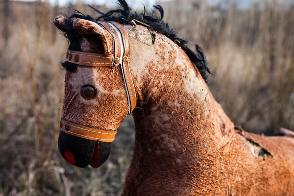 Close-up of the old thrown away rocking horse — Stock Photo, Image