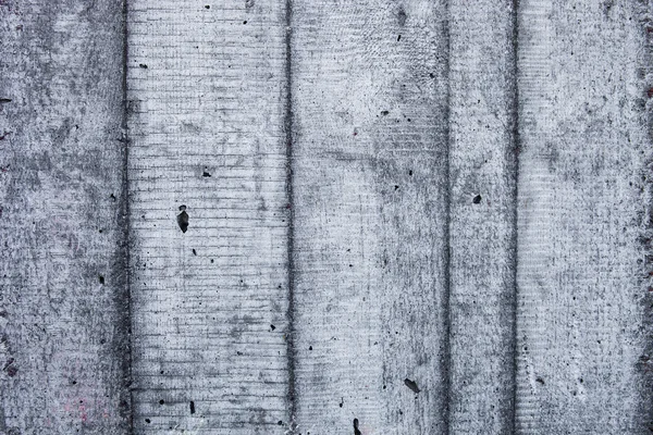 Šedá betonová zeď s tvrzené stopy bedněním forem — Stock fotografie