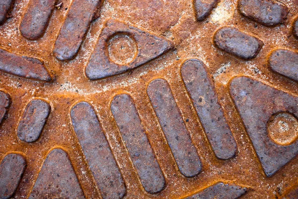 Closeup of the metal manhole cover surface — Stock Photo, Image