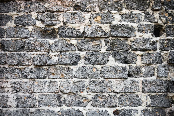 Alvenaria de tijolo com textura rica e variada — Fotografia de Stock