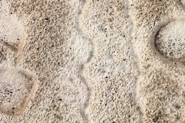 Песчаная поверхность после дождя — стоковое фото