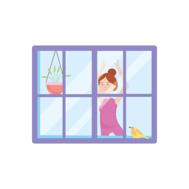 Evde yoga yapan bir kadının penceresinden bakmak.