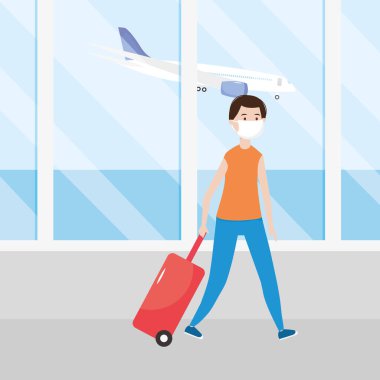 Havaalanı yeni normal, maskeli ve bavullu adam.