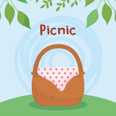 piknik sepeti mavi arkaplan ve dekoratif yaprakların üzerinde