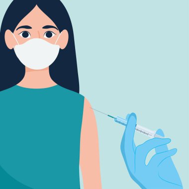 Kadın aşı oluyor.