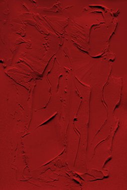 Dokulu arkaplanda gerçek kırmızı soyut akrilik desenli resim. 