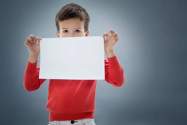 Six Year Old Caucasian Boy Studio Blank Sheet Paper Hands — Stock Photo, Image