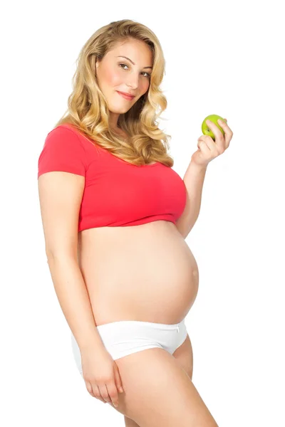 Gravid kvinna med äpple — Stockfoto