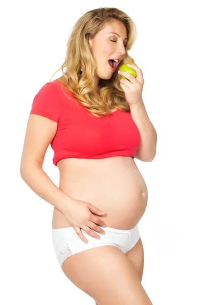 Gravid kvinna med äpple — Stockfoto