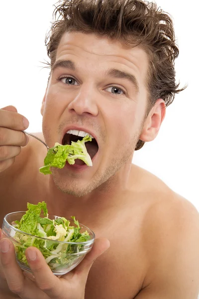 Un homme qui mange de la salade — Photo