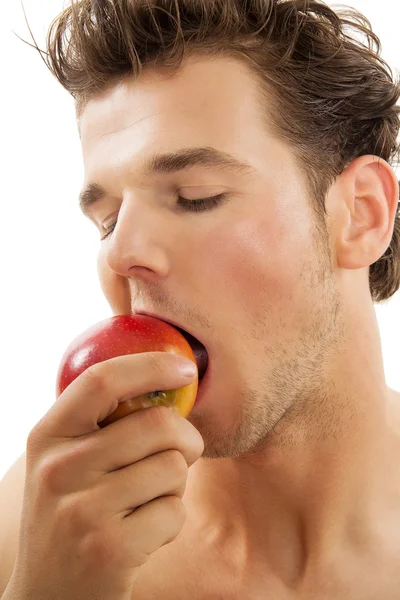 Mies omenan kanssa — kuvapankkivalokuva