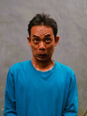 Güneydoğu Asyalı bir adamın komik, aptal ya da 