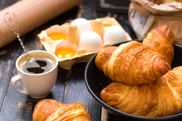 Croissants, baguettes, flour, eggs, spoon, rolling pin — Stock Photo, Image