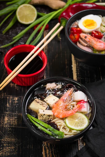 Table served with asian noodle soup — Stock Image Table served with asian noodle soup Royalty Free Stock Photos