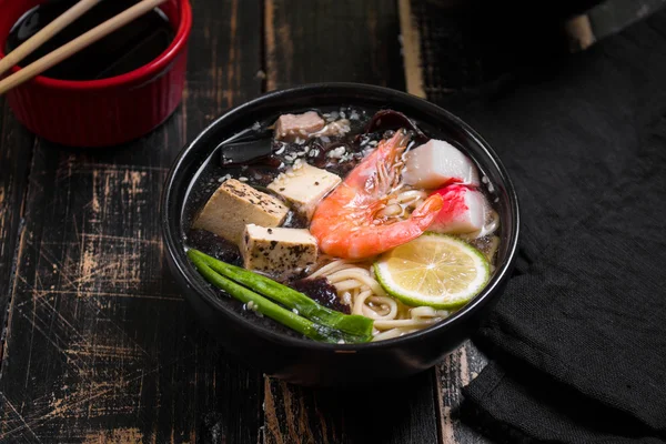 Table served with asian noodle soup — Stock Image Table served with asian noodle soup Stock Photo