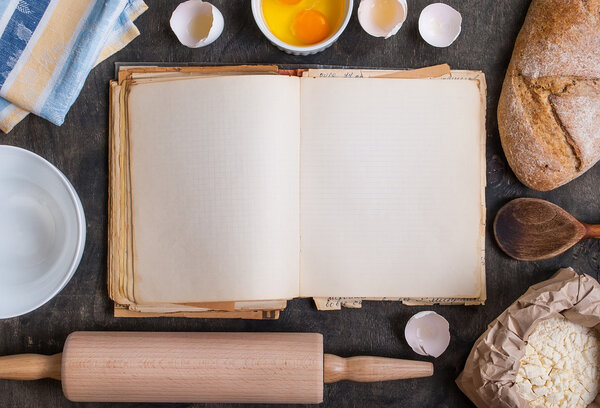 Baking background with blank cook book, flour, rolling pin