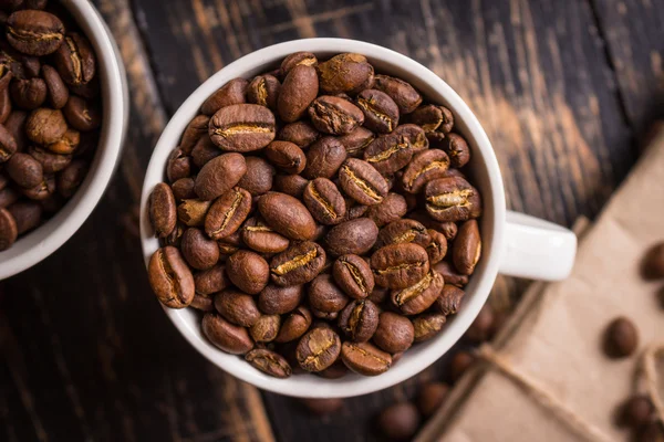 Coffee beans in a cups — Stock Photo, Image