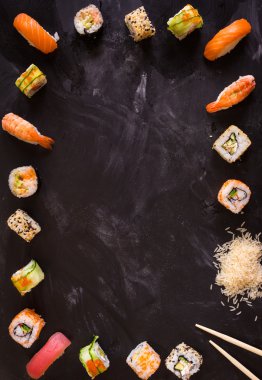 Sushi set on dark background. Minimalism clipart