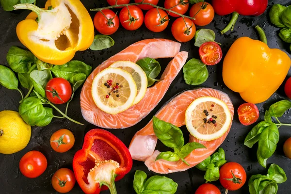 Raw salmon steaks and fresh ingredients for cooking — Stock Fotó