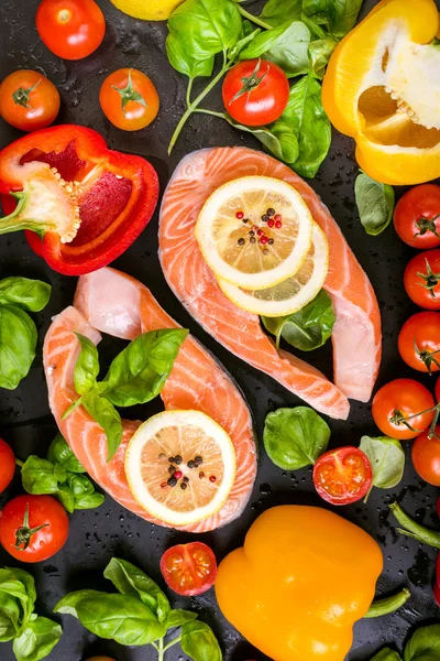 Raw salmon steaks and fresh ingredients for cooking — Stok fotoğraf