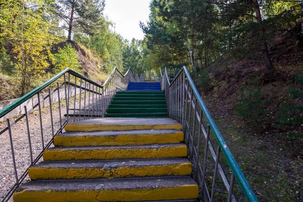 colored stairs to climb the hill in the park