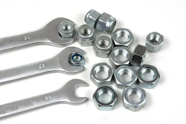 Set Wrenches Several Nuts White Background — Stock Photo, Image