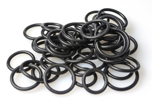 several sealing rings of different sizes in black close-up