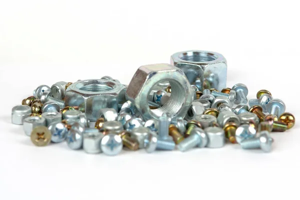 Een Groep Kleine Bouten Grote Metalen Moeren — Stockfoto